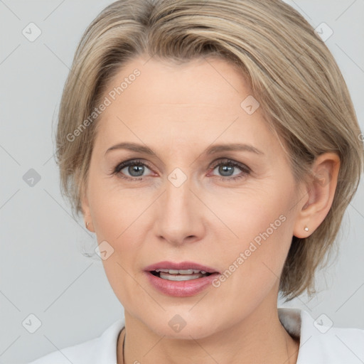 Joyful white adult female with medium  brown hair and grey eyes