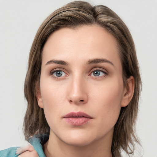 Neutral white young-adult female with medium  brown hair and blue eyes