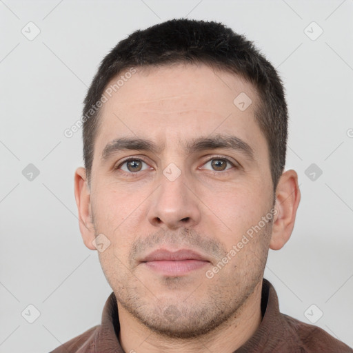 Neutral white adult male with short  brown hair and brown eyes