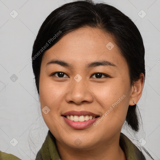 Joyful asian young-adult female with medium  brown hair and brown eyes