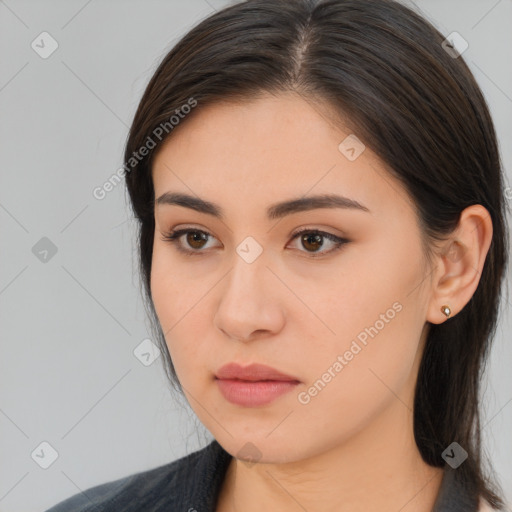 Neutral white young-adult female with long  brown hair and brown eyes