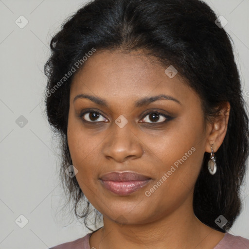 Joyful black young-adult female with long  brown hair and brown eyes