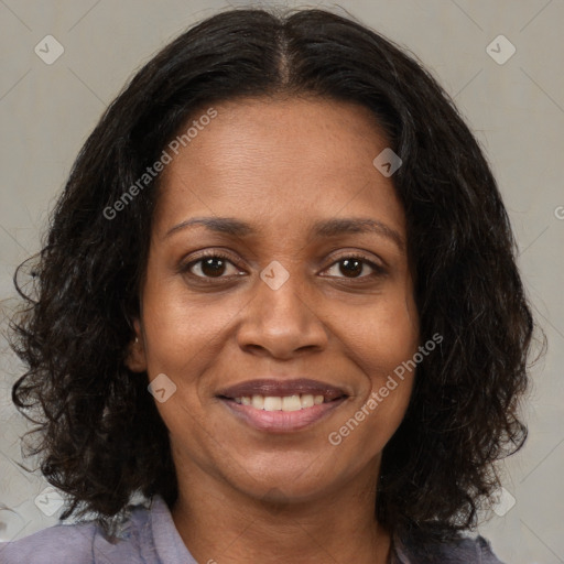 Joyful black young-adult female with medium  brown hair and brown eyes