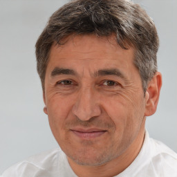 Joyful white middle-aged male with short  brown hair and brown eyes