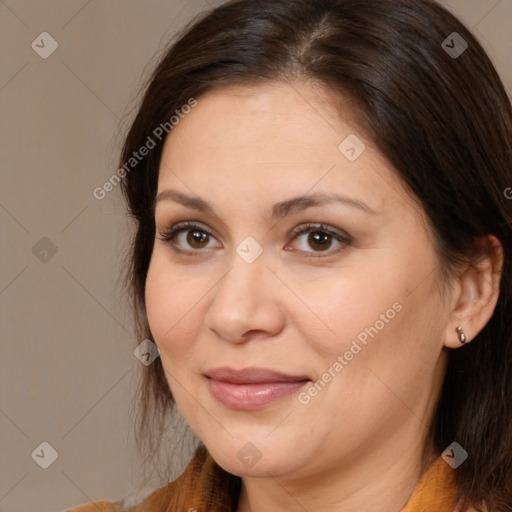 Joyful white adult female with medium  brown hair and brown eyes