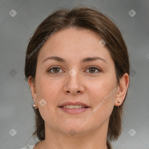 Joyful white adult female with medium  brown hair and grey eyes