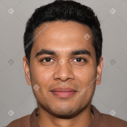 Joyful latino young-adult male with short  black hair and brown eyes