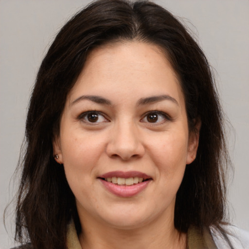 Joyful white young-adult female with medium  brown hair and brown eyes