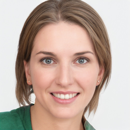 Joyful white young-adult female with medium  brown hair and blue eyes