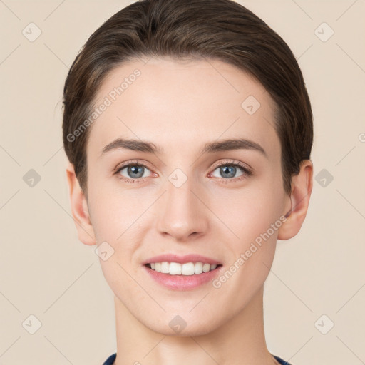 Joyful white young-adult female with short  brown hair and grey eyes