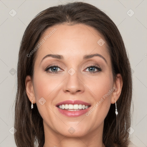 Joyful white young-adult female with medium  brown hair and grey eyes