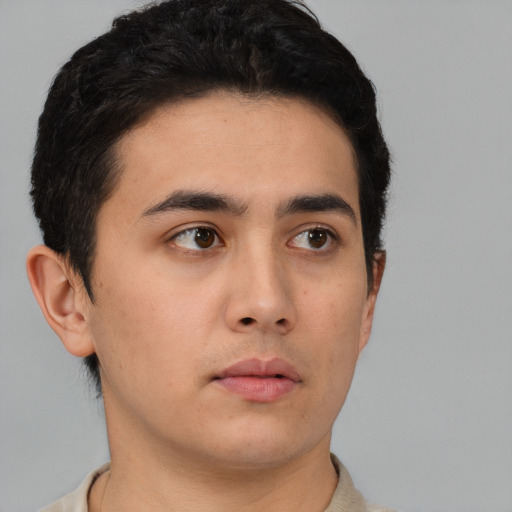 Neutral white young-adult male with short  black hair and brown eyes