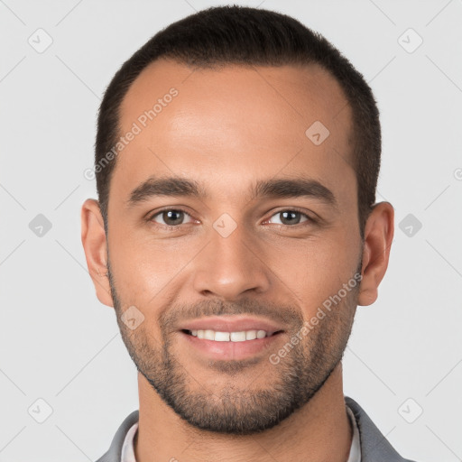 Joyful white young-adult male with short  brown hair and brown eyes