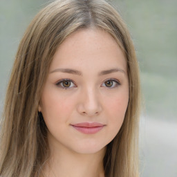 Joyful white young-adult female with long  brown hair and green eyes