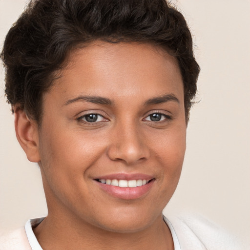 Joyful white young-adult female with short  brown hair and brown eyes