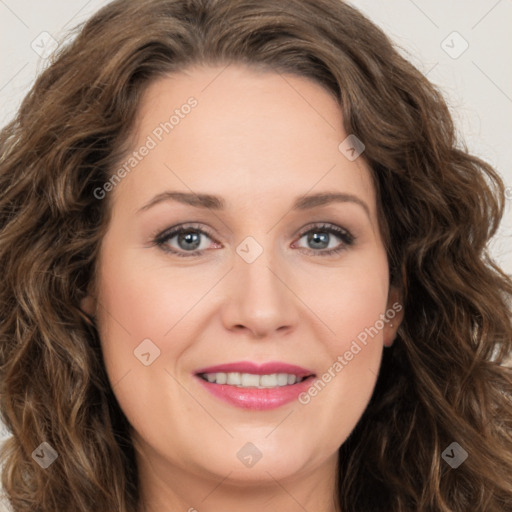 Joyful white young-adult female with long  brown hair and green eyes