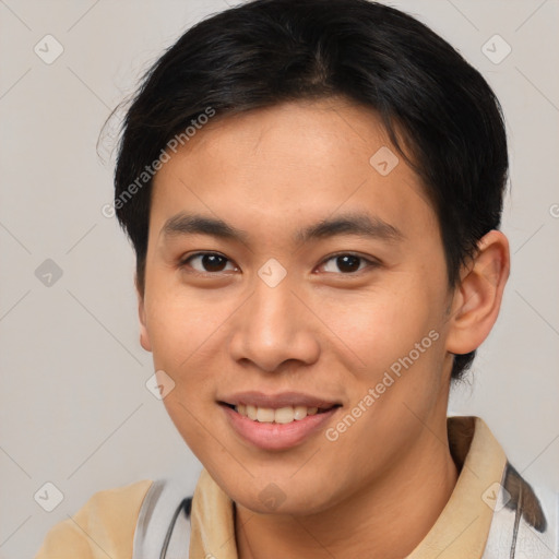 Joyful asian young-adult male with short  brown hair and brown eyes