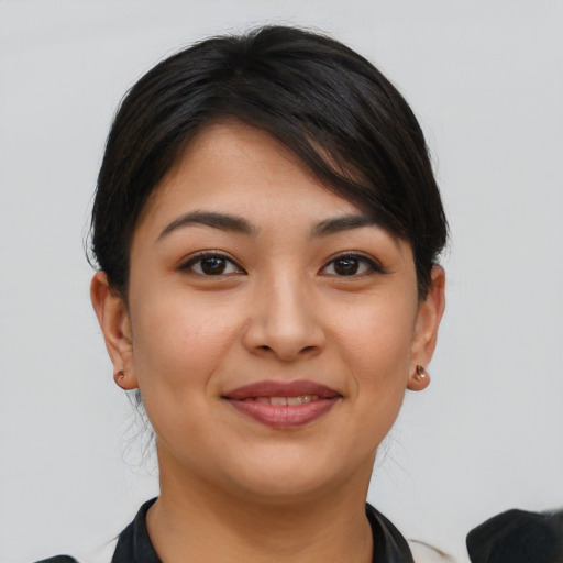 Joyful asian young-adult female with short  brown hair and brown eyes