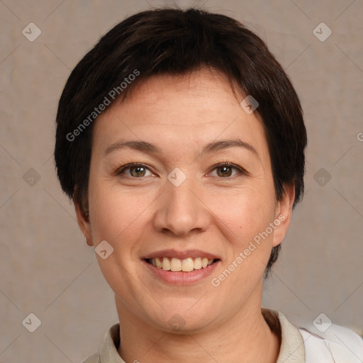 Joyful white adult female with short  brown hair and brown eyes