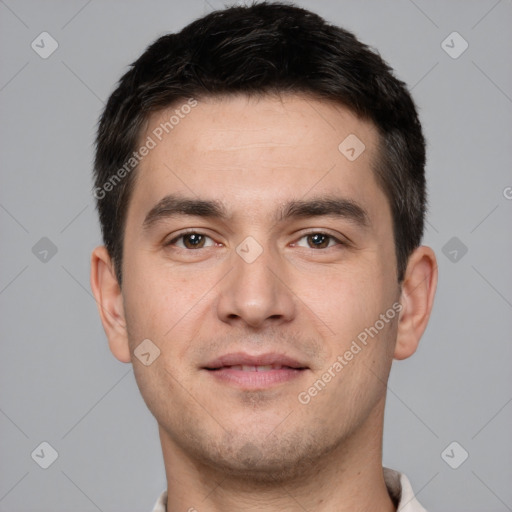 Joyful white young-adult male with short  brown hair and brown eyes