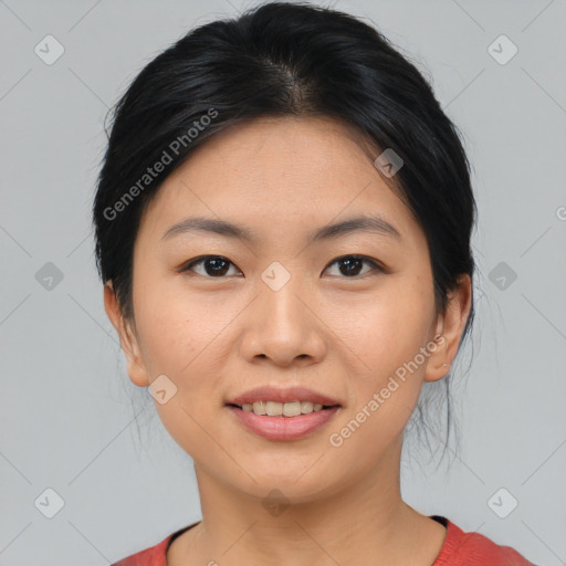 Joyful asian young-adult female with medium  black hair and brown eyes