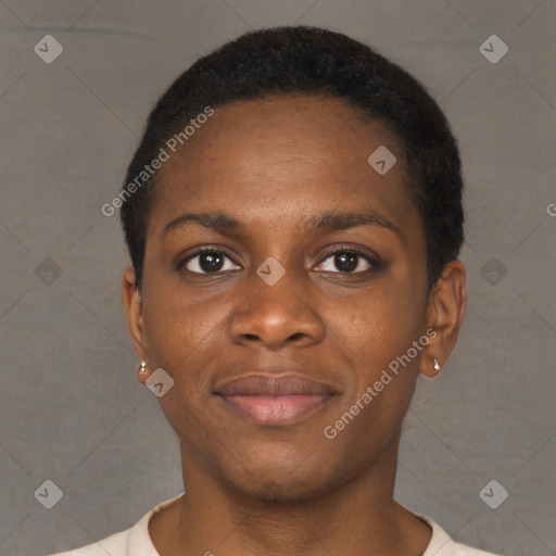 Joyful black young-adult female with short  brown hair and brown eyes