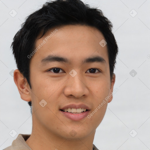 Joyful asian young-adult male with short  brown hair and brown eyes