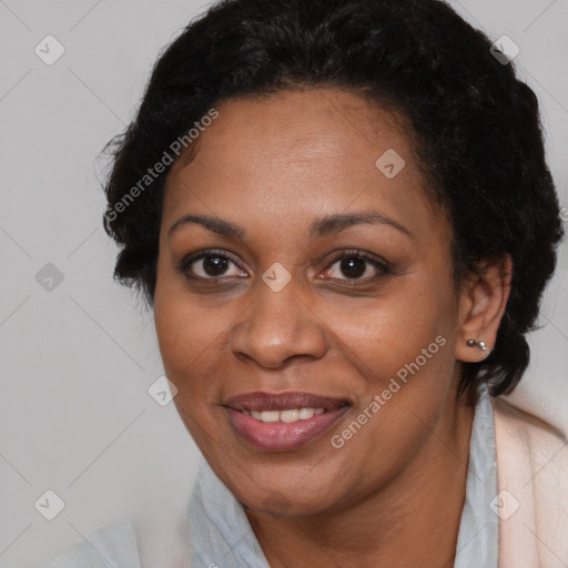 Joyful black adult female with short  brown hair and brown eyes