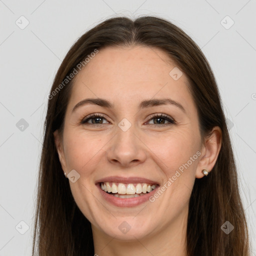 Joyful white young-adult female with long  brown hair and grey eyes