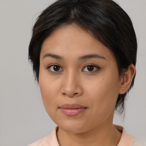 Joyful asian young-adult female with medium  brown hair and brown eyes