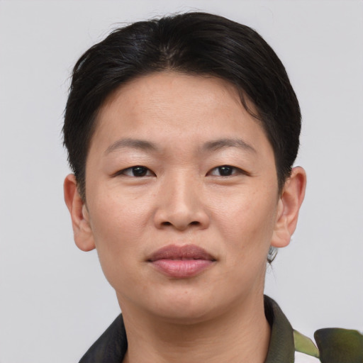 Joyful asian young-adult female with short  brown hair and brown eyes