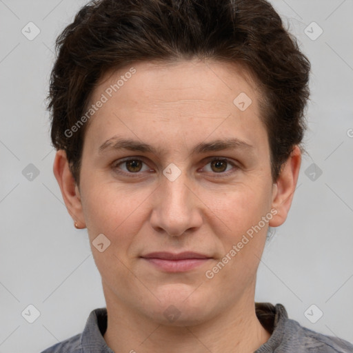 Joyful white adult female with short  brown hair and grey eyes