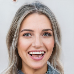 Joyful white young-adult female with long  brown hair and blue eyes