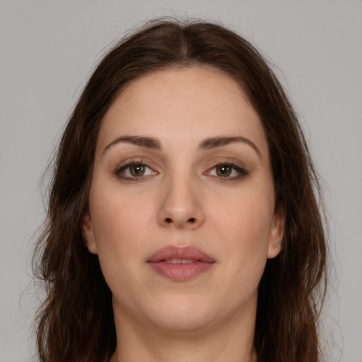 Neutral white young-adult female with long  brown hair and brown eyes