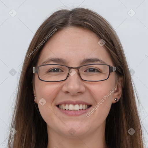 Joyful white adult female with long  brown hair and grey eyes