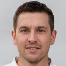 Joyful white young-adult male with short  brown hair and brown eyes