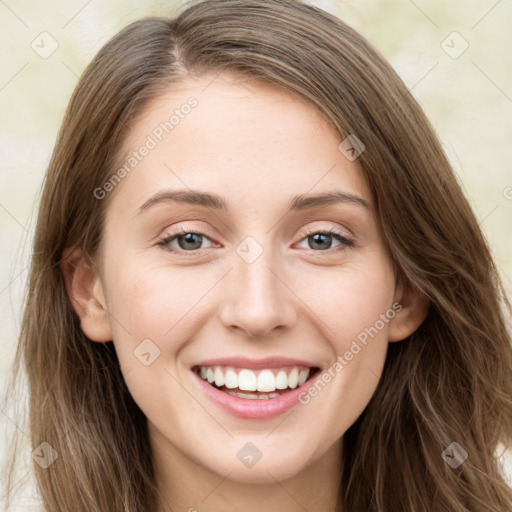 Joyful white young-adult female with long  brown hair and green eyes