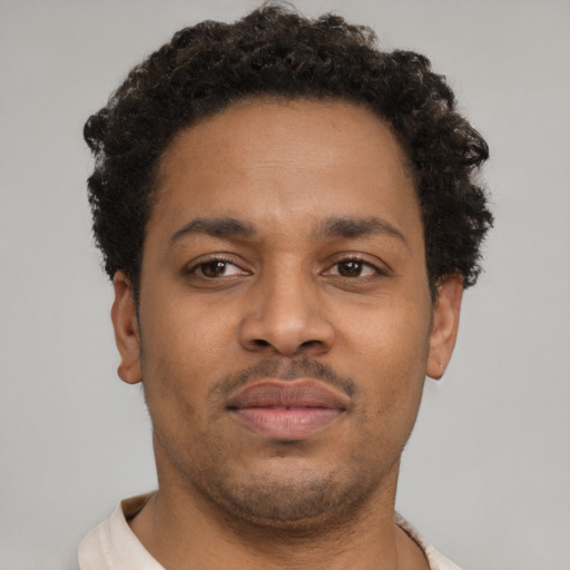 Neutral latino young-adult male with short  brown hair and brown eyes