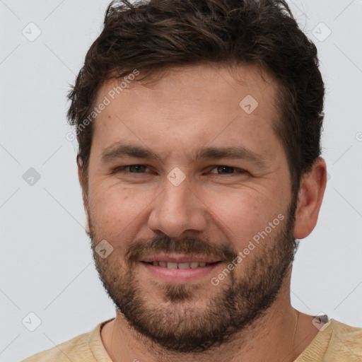 Joyful white adult male with short  brown hair and brown eyes