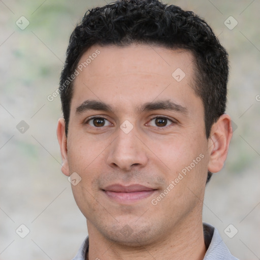 Joyful white young-adult male with short  black hair and brown eyes