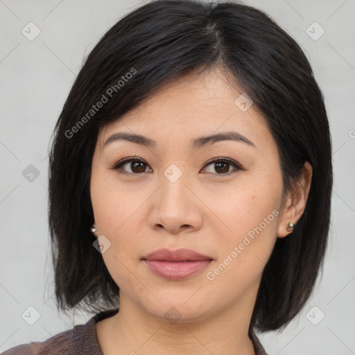 Joyful asian young-adult female with medium  black hair and brown eyes