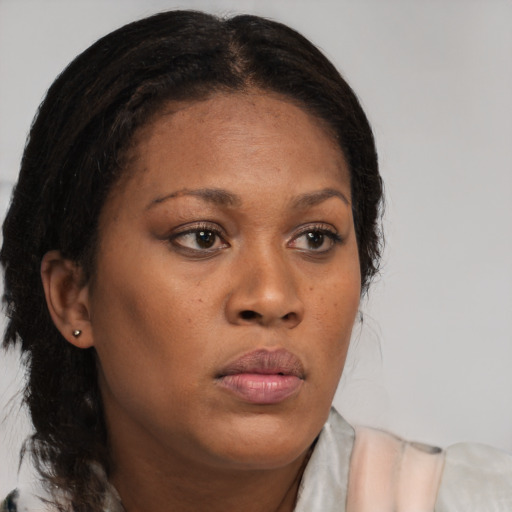 Neutral black young-adult female with medium  brown hair and brown eyes