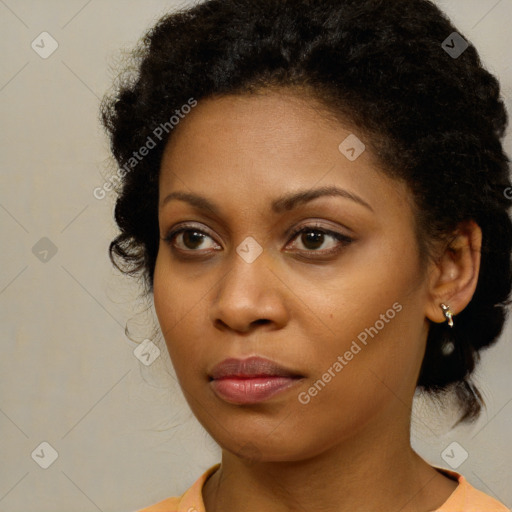 Neutral black young-adult female with medium  brown hair and brown eyes