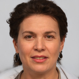 Joyful white adult female with short  brown hair and brown eyes