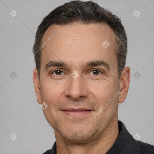 Joyful white adult male with short  brown hair and brown eyes