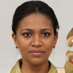 Joyful black young-adult female with medium  brown hair and brown eyes