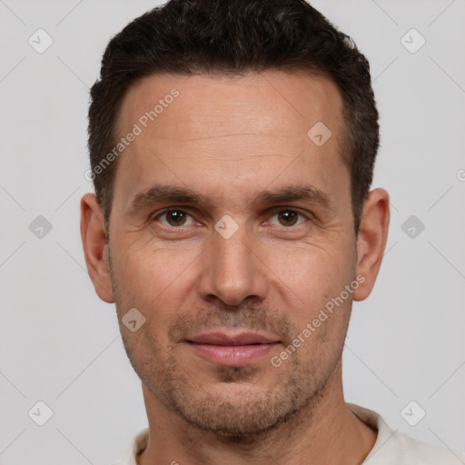 Joyful white adult male with short  brown hair and brown eyes