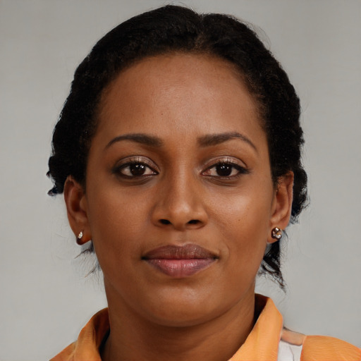 Joyful black young-adult female with medium  brown hair and brown eyes