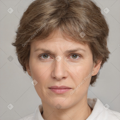 Joyful white adult female with short  brown hair and grey eyes