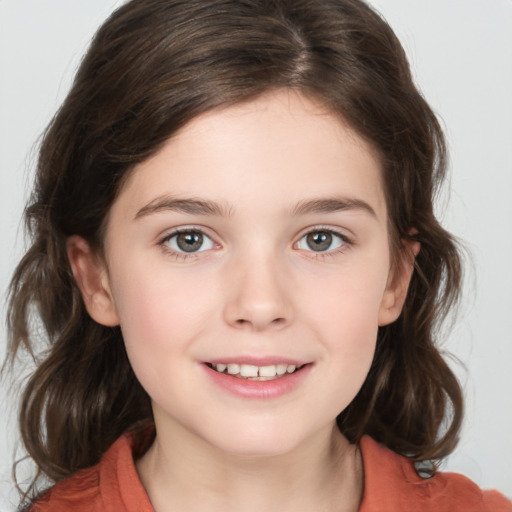 Joyful white child female with medium  brown hair and brown eyes